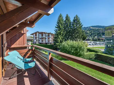 a kitchen and living room with wooden ceilings at Appartement 3 ch. à Megève proche centre - FR-1-569-125 in Megève