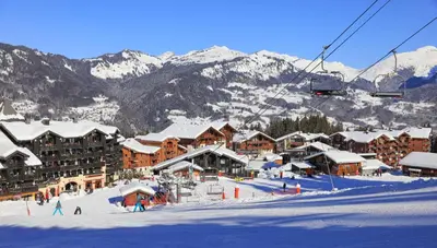 a ski resort with snow covered buildings and a ski lift at Les Eterlous 28 - Appt montagne 4 pers in Morillon