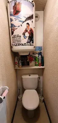 a bathroom with a movie poster above a toilet at Résidence Les Coralines Bat A - Coralines A3 MAE-0314 in Megève