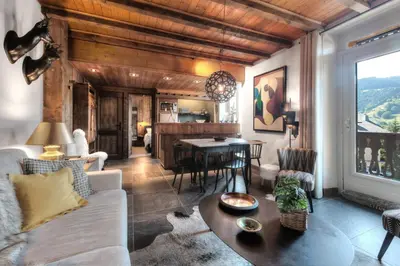 a living room with a couch and a table at Tatiana I in Megève
