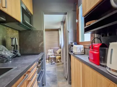 a kitchen with a counter with a red appliance at Studio rénové à Flaine, proche des pistes et commerces - FR-1-425-207 in Arâches-la-Frasse