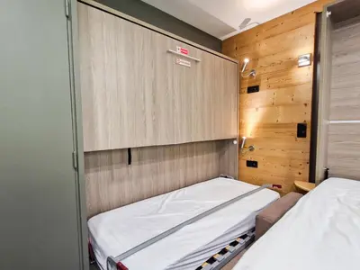 a small room with a bed and a closet at Studio rénové à Flaine, proche des pistes et commerces - FR-1-425-207 in Arâches-la-Frasse