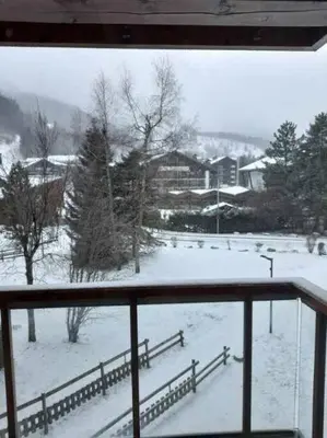 a view of a snow covered field from a window at Les contamines Montjoie 1 CHAMBRE 4 personnes in Les Contamines-Montjoie