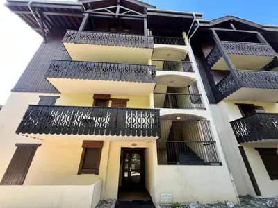 an exterior view of a building with balconies at Grand T3 familial au cœur de Samoëns avec parking et wifi - FR-1-624-148 in Samoëns