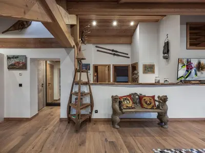a living room with a couch and a ladder at Appartement rénové au centre de Megève avec balcon et parking - FR-1-569-137 in Megève