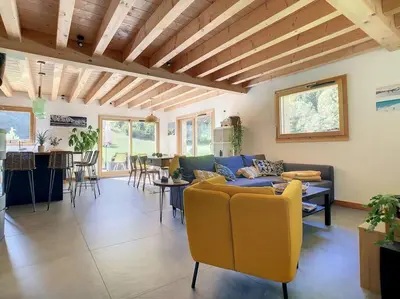a living room with a couch and a table at Le Vivier in Saint-Gervais-les-Bains