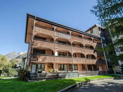 a building with balconies on the side of it at Appartement cosy à Chamonix pour 4, balcon, parking - FR-1-343-250 in Chamonix-Mont-Blanc