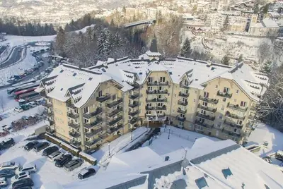 an aerial view of a hotel in the snow at Next to the ski lift! *3bed Apt* sleeps 8* Parking* Pool in Saint-Gervais-les-Bains