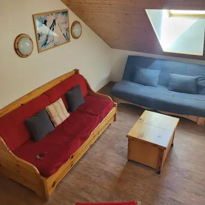 a living room with a couch and a table at Next to the ski lift! *3bed Apt* sleeps 8* Parking* Pool in Saint-Gervais-les-Bains