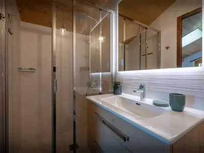 a bathroom with a sink and a shower at Le Primpiolet - OVO Network in Combloux
