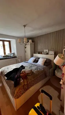 a bedroom with a large bed in a room at Hygge and Lykke in Saint-Gervais-les-Bains