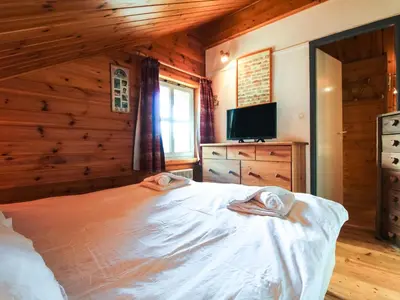 a bedroom with a bed with two towels on it at Chalet lumineux à Flaine avec garage et grand salon - FR-1-425-210 in Arâches-la-Frasse