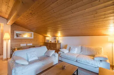 a room with two beds and a wooden ceiling at Appartement Denali - Welkeys in Demi-Quartier