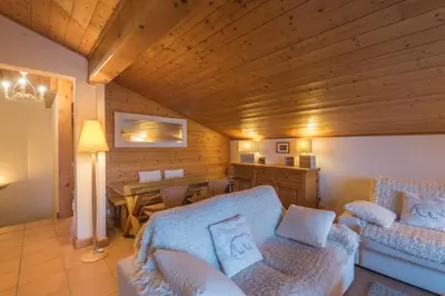 a living room with a couch and a table at Appartement Denali - Welkeys in Demi-Quartier