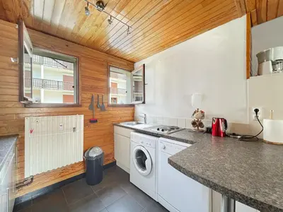a kitchen with a washer and dryer at 3 Pièces 6/8 Pers centre Carroz (AA111) in Les Carroz d'Araches