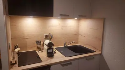 a kitchen with a sink and a counter top at Studio au pied des remontées/wifi/smart TV/parking in Les Contamines-Montjoie
