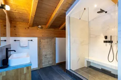 a bathroom with a shower and a sink at Chalet Gloribel in Chamonix-Mont-Blanc
