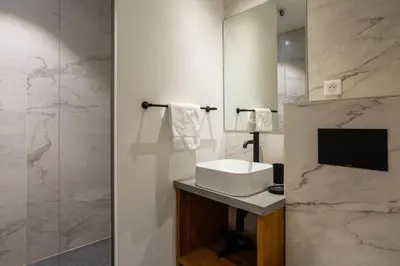 a bathroom with a sink and a mirror at Chalet Gloribel in Chamonix-Mont-Blanc