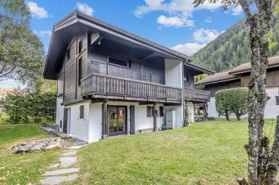 an exterior view of a house with a yard at Appartement Sous-Bois - Welkeys in Chamonix-Mont-Blanc