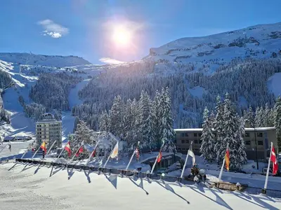 a group of flags on top of a snow covered mountain at Appartement confortable · Proche pistes · WIFI gratuit - FR-1-425-211 in Arâches-la-Frasse
