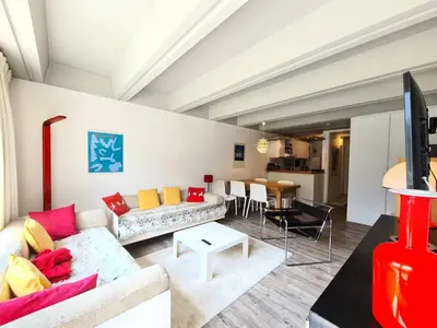 a living room with a couch and a table at Résidence Cassiopee - Appartement tout confort · proche des pistes · WIFI gratuit · vue pistes MAE-4984 in Magland