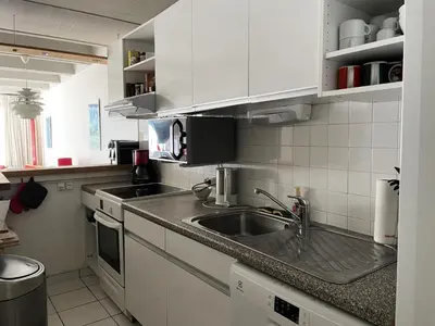 a kitchen with white cabinets and a sink at Résidence Cassiopee - Appartement tout confort · proche des pistes · WIFI gratuit · vue pistes MAE-4984 in Magland