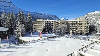 a resort in the snow with trees and mountains at Résidence Cassiopee - Appartement tout confort · proche des pistes · WIFI gratuit · vue pistes MAE-4984 in Magland