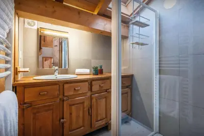 a bathroom with a sink and a shower at Chalet Timothy - OVO Network in Samoëns