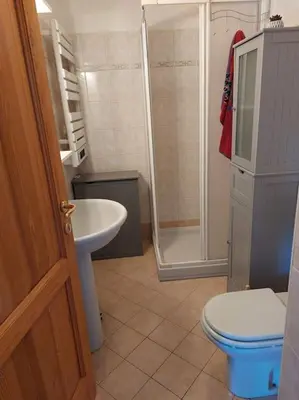 a bathroom with a toilet and a sink and a shower at Appartement Saint Gervais proche centre in Saint-Gervais-les-Bains