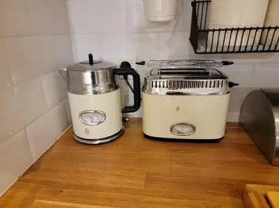 two appliances sitting on a counter next to a toaster at Chamonix Garden Flat with a View of Mont-Blanc - Référence XEPKMM in Chamonix-Mont-Blanc