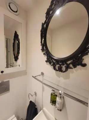 a bathroom with a mirror and a sink at Chamonix Garden Flat with a View of Mont-Blanc - Référence XEPKMM in Chamonix-Mont-Blanc
