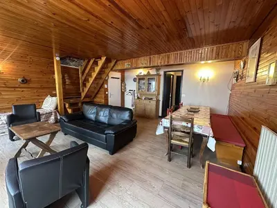 a living room with a couch and a table at Duplex de 100m² pour 9 personnes au centre proche remontées mécaniques - FR-1-572-290 in Arâches-la-Frasse
