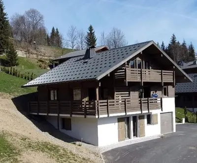 a large wooden house with a gambrel roof at Chalet Anatole - Vue Mont Blanc Exceptionnelle in Saint-Gervais-les-Bains