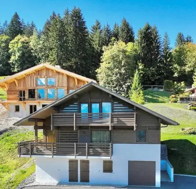 a large house with a wooden at Chalet Anatole - Vue Mont Blanc Exceptionnelle in Saint-Gervais-les-Bains