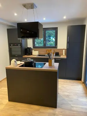 a kitchen with a counter and a stove top oven at CHALET CAREVA in Les Houches