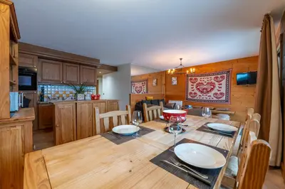 a kitchen and dining room with a table and chairs at Appt Bec D1 - Happy Rentals in Chamonix-Mont-Blanc