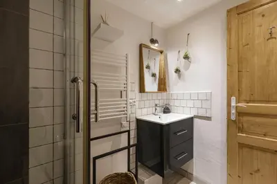 a bathroom with a sink and a shower at Le Cham' 106 - Happy Rentals in Chamonix-Mont-Blanc