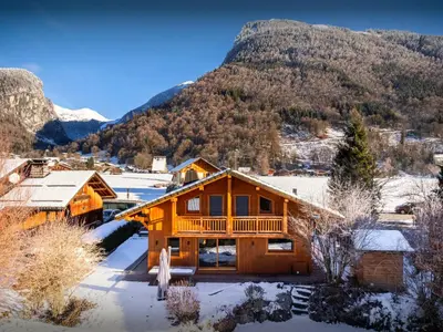 a log cabin in the mountains in the snow at Chalet Evonyx - OVO Network in Samoëns