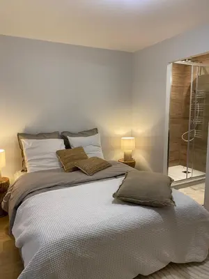 a bedroom with a bed with two pillows on it at Appartement PISTE ROUGE in Les Houches
