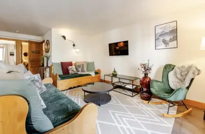 a living room with a couch and chairs and a table at Loriaz 12 - Appartement avec vue et piscine à deux pas du telecabine in Vallorcine