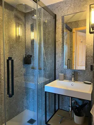 a bathroom with a sink and a shower at Chalet L'AS DE CARROZ in Arâches-la-Frasse