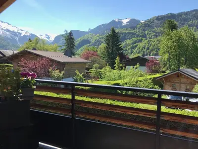 a view from a balcony with mountains in the background at Appartement Rêve de Montagne in Samoëns
