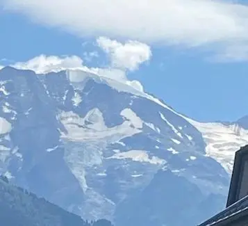 a view of a snow covered mountain from an airplane at Côté DÔMES in Saint-Gervais-les-Bains
