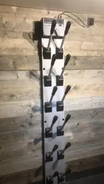 a group of tennis rackets on a wooden wall at Chalet de charme aux Carroz d'Arrâches-Flaines in Les Carroz d'Araches