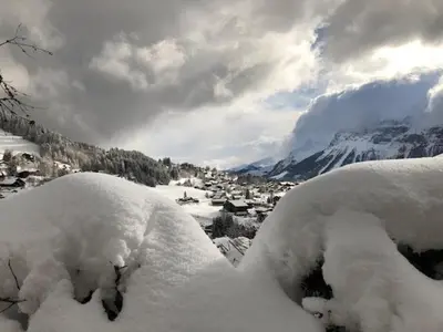 a pile of snow on the side of a mountain at Chalet de charme aux Carroz d'Arrâches-Flaines in Les Carroz d'Araches