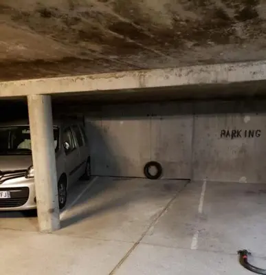 a parking garage with a van parked in it at Appartement Cosy, Vue Mont Blanc, Plein Centre in Chamonix-Mont-Blanc