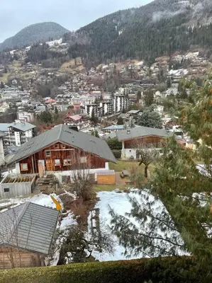 a view of a city with snow on the ground at Charmant appartement T3 avec magnifique vue in Saint-Gervais-les-Bains