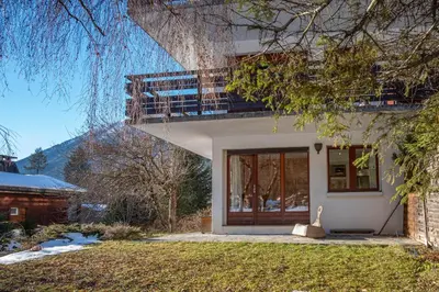 a house with a balcony on top of it at Les Tussilages - Terrasse vue Mont-Blanc in Chamonix-Mont-Blanc
