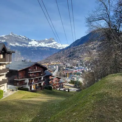a car parked in front of a building with balconies at Hike, Bike, Ski, open the door and Go! in Saint-Gervais-les-Bains