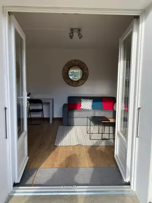 a living room with a couch and a table at Appartement cosy avec vue exceptionnelle in Saint-Gervais-les-Bains
